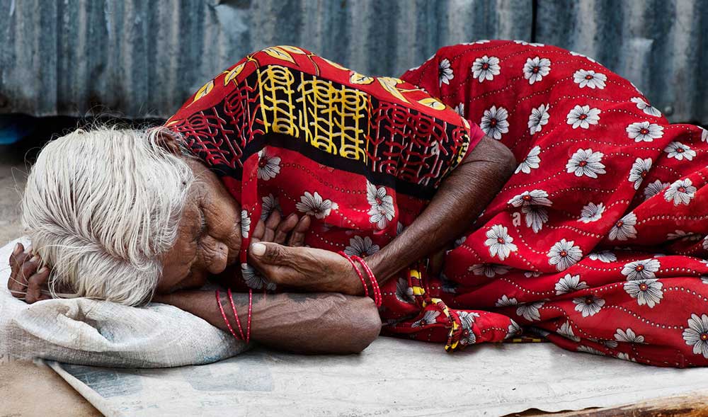 Hungry Woman Sleeping On The Street